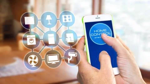 Using smart home app on phone. Smart home control concept. Stock Photos