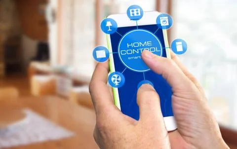 Using smart home app on phone. Smart home control concept. Stock Photos
