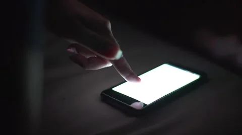 Using smart phone in dark Stock Footage 68416689
