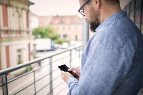 Using smart phone during break at work Stock Photos