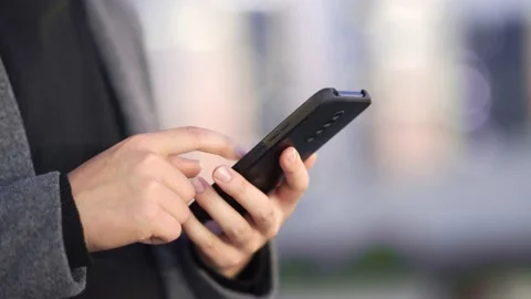 Using smart phone Video stock 165798103