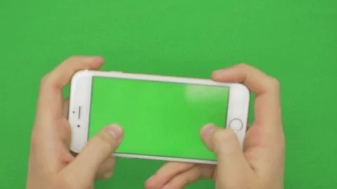 Using smart phone on green screen with various hand gestures, horizontally Stock Footage 83346395