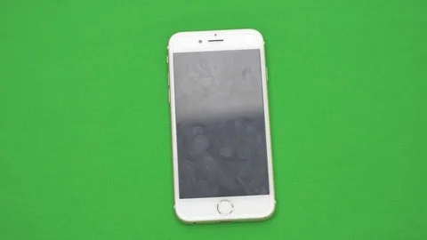 Using smart phone on green screen with various hand gestures, vertikal, close up Video stock 83647419