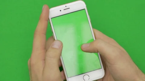 Using smart phone on green screen with various hand gestures, vertikal, close up Stock Footage 83647455