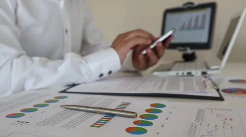 Using smart phone in office Stock Footage 67424206