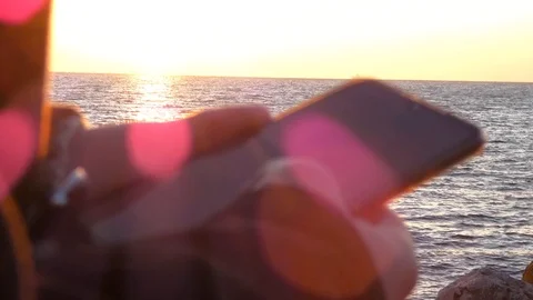 Using Smart phone on Seaside Stock Footage 123767066
