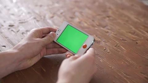 Using smart phone on wood table various hand gestures, vertical Video stock 61730201