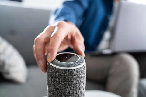 Using Smart Voice Assistant Wireless Speaker Stock Photos