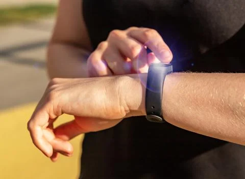 Using smart watch on hand closeup Stock Photos