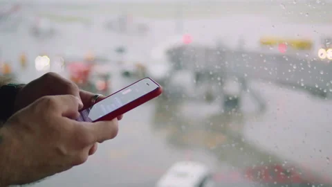 Using smartphone at the airport Stock-Footage 165348151