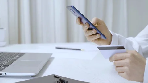 Using a smartphone and a credit card for shopping in the online store. Stock Footage 124606024