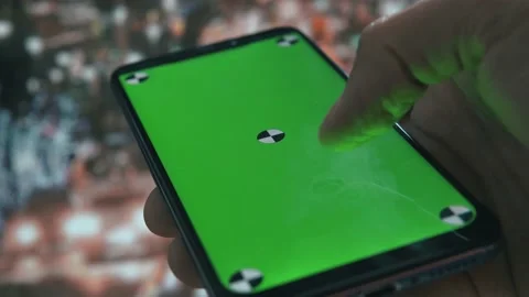Using smartphone in big city, green screen with markers, traffic lights. 動画素材 138154711