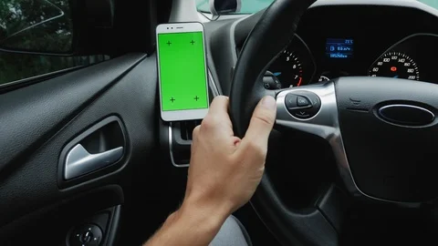 Using smartphone in car with green screen monitor Stock Footage 111706216