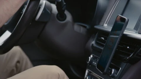 Using Smartphone on Car Phone Holder While Driving Stock Footage 255368415