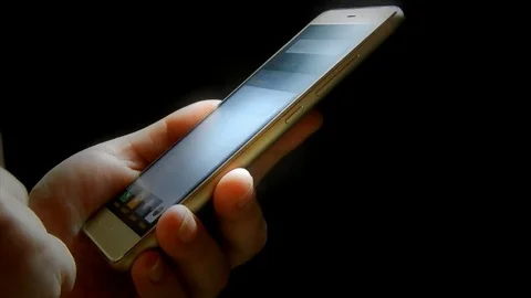 Using smartphone in a dark room. Accent lighting Stock Footage 72261014