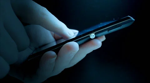 Using smartphone in dark room Stock Footage 45949689