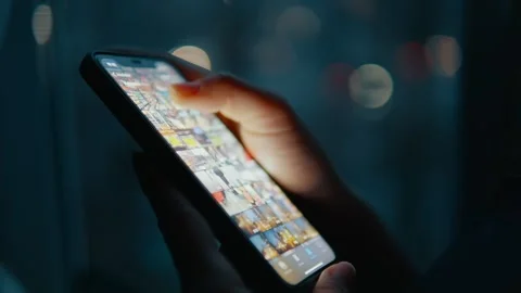 Using a smartphone in a dark room Stock Footage 240124663