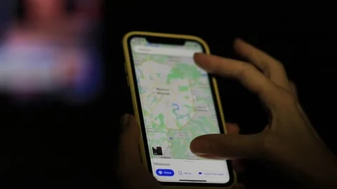 Using smartphone to find destination on map application. Navigation and Stock Footage 250251696