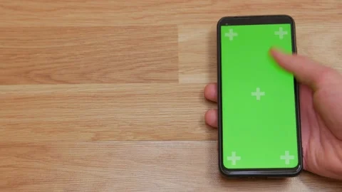 Using Smartphone with Green Mock-up Screen green chroma key screen, hand ge.. Stock Footage 272780716
