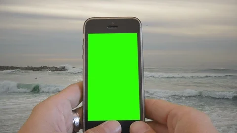 Using Smartphone Green Screen Relaxed By Ocean Beach Video stock 116262680