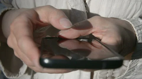 Using smartphone by hand Stock Footage 63440371