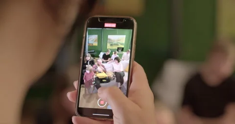 Using a smartphone handheld, digital zoom. Capturing important points phone Stock Footage 247798448