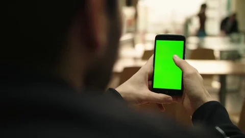 Using a smartphone in the mall green screen chroma key Stock Footage 84688878