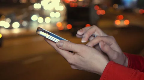 Using smartphone at night in city Stock Footage 60787764