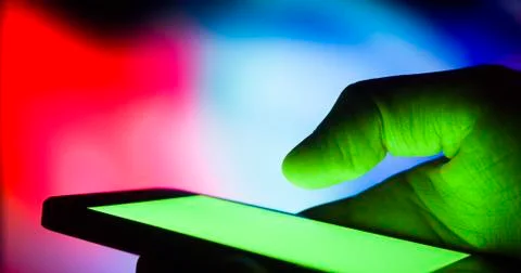 Using smartphone at night - green screen chroma key for replacing the screen ima Stock Photos