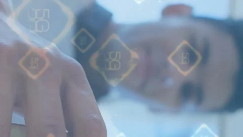 Using smartphone, person interacting with 5G technology animation in foreground Stock Footage 312510640