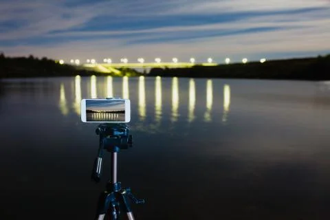 Using smartphone like professional camera on tripod to capturing night landscape Stock Photos