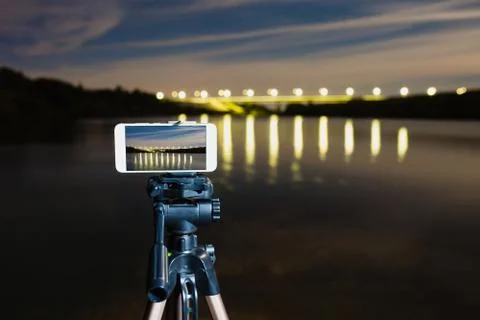 Using smartphone like professional camera on tripod to capturing night landscape Stock Photos