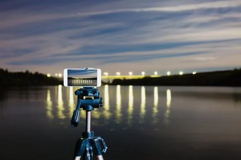 Using smartphone like professional camera on tripod to capturing night landscape Stock Photos