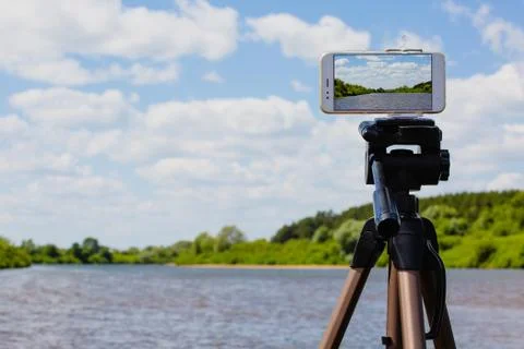 Using smartphone like professional photo camera on tripod Stock Photos