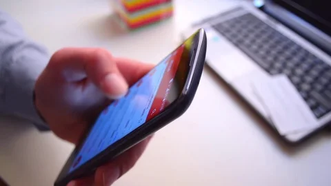 Using smartphone, seamless loop background, finger scrolling up list on screen 스톡 동영상 74070694