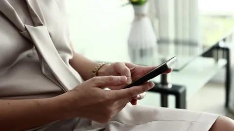 Using smartphone on sofa Stock Footage 310864859
