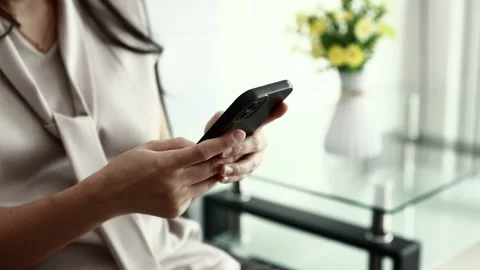Using smartphone on sofa Stock Footage 310864860