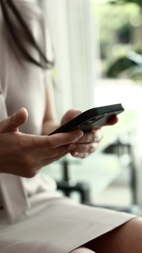Using smartphone on sofa Stock Footage 310864866