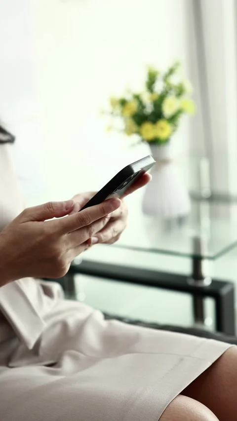 Using smartphone on sofa Stock Footage 310864867