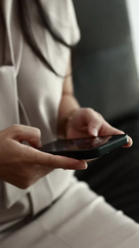 Using smartphone on sofa Stock Footage 310864895