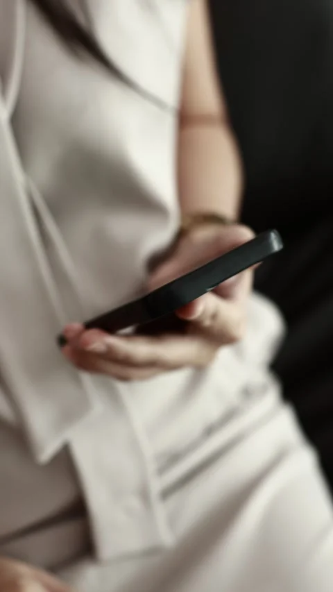 Using smartphone on sofa Stock Footage 310864904