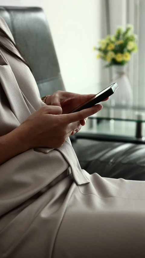 Using smartphone on sofa Stock Footage 310864905