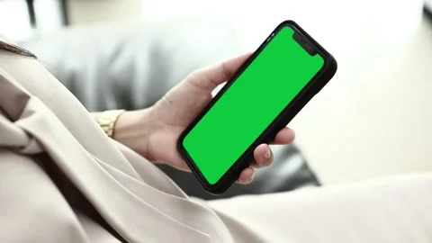 Using smartphone on sofa Stock Footage 310864906
