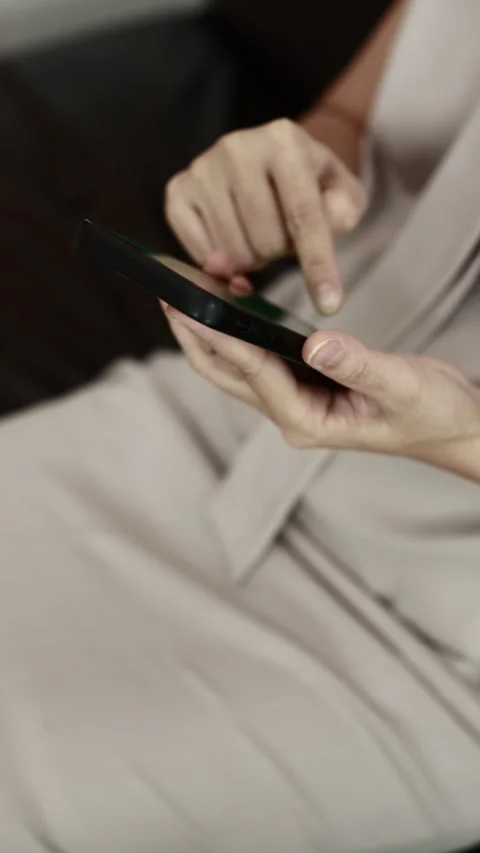 Using smartphone on sofa Stock Footage 310864910