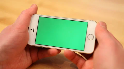 Using smartphone on table - various hand gestures - horizontal - green screen Stock Footage 33605618