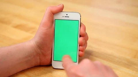 Using smartphone on table - various hand gestures - vertical - green screen Stock Footage 33606069