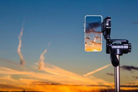 Using smartphone on tripod to capturing stunning sundown Stock Photos
