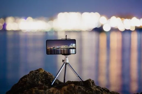 Using smartphone on tripod to making the photo of night landscape Stock Photos
