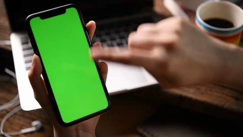 Using smartphone with a vertical green screen . Stock Footage 127407552