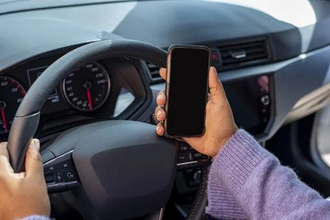 Using smartphone while driving Stock Photos